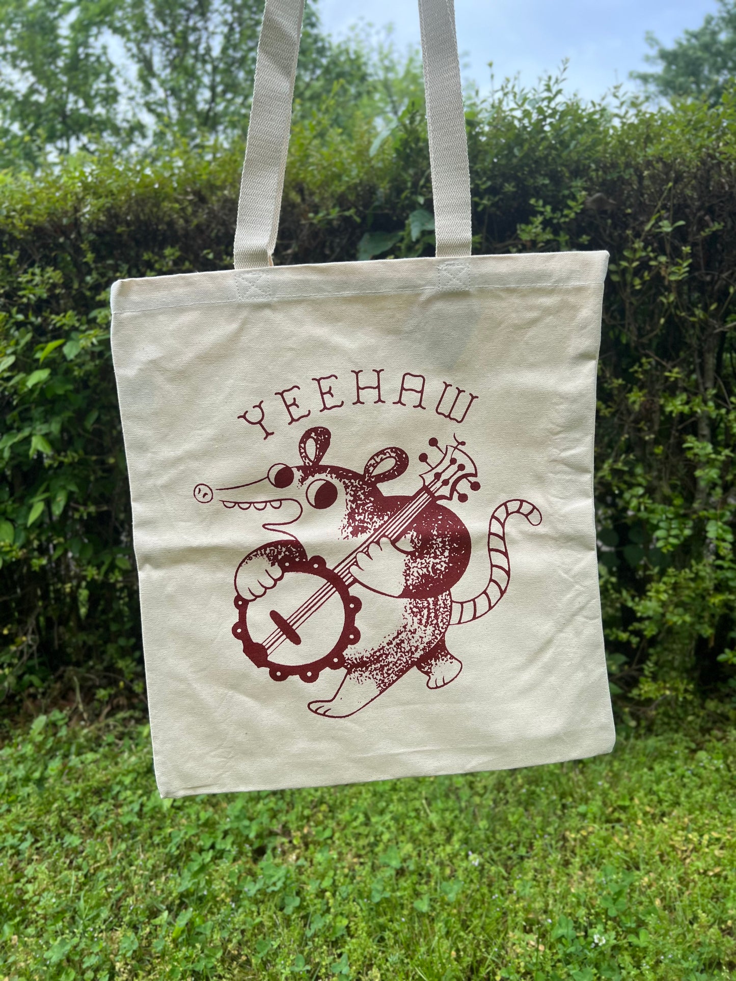 Yeehaw banjo possum tote bag